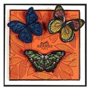Three embroidered butterflies on orange Hermes leather, framed mixed media by Stephen Wilson