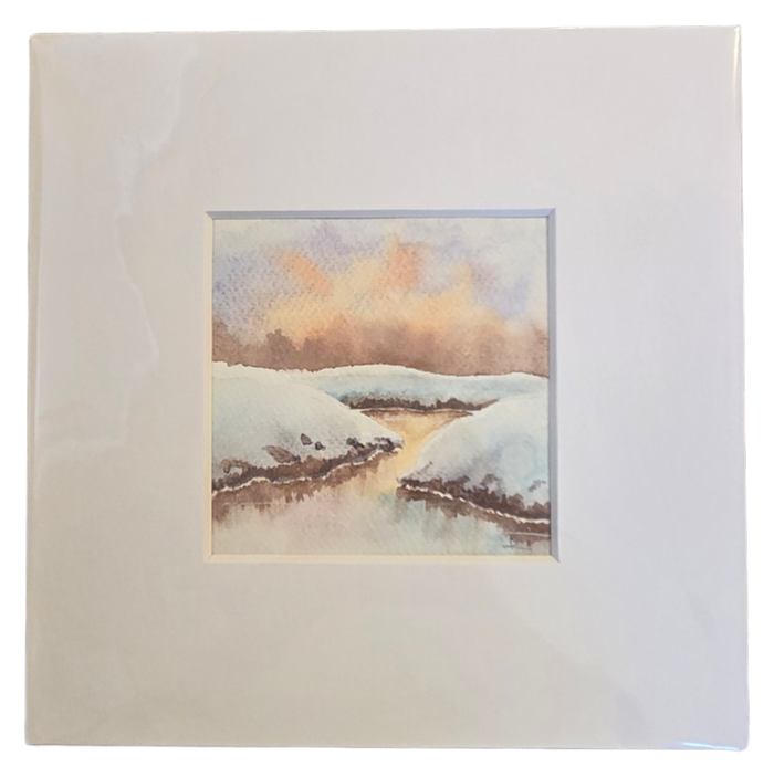 Watercolor of a snowy creek at dusk with warm sky reflections, shown matted, by Roxanne Langley