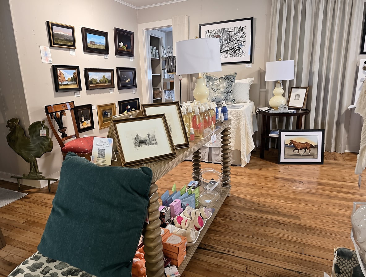 A gallery corner with paintings and styled furniture at Langley Art & Home